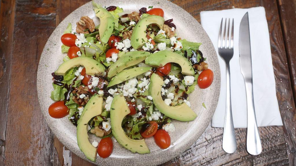 Avocado Salad · Romaine, avocado, cranberries, walnuts, and tomatoes, topped with goat cheese crumbles. Balsamic vinaigrette dressing served on the side.