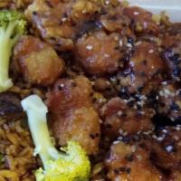 Sesame Chicken · Tender pieces of chicken quickly sautéed and pan flipped over a high flame, blended in an ex...