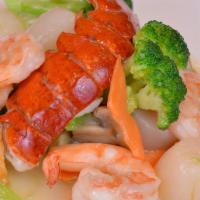 Seafood Deluxe · Lobster tail, jumbo shrimp, scallops sautéed with assorted vegetables in white sauce.