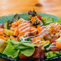 Spicy Sashimi Salad · An assortment of fresh sashimi over mixed greens.