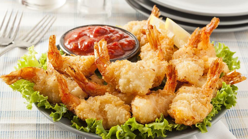 Butterfly Shrimp · Hearty prawns breaded and served with a sweet chili dipping sauce.