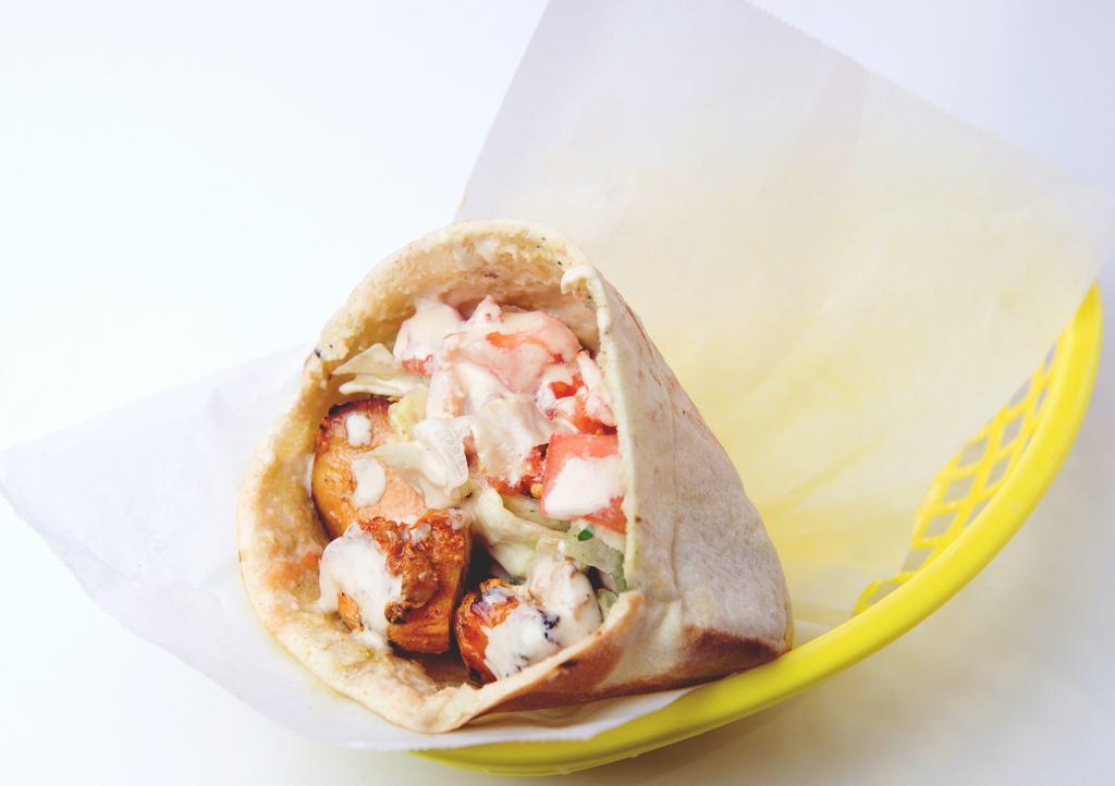 Chicken Kebob Sandwich · Marinated cubes of chicken breast, skewered and grilled;  served in a pita pocket with lettuce, tomatoes, onions, and tahineh sauce