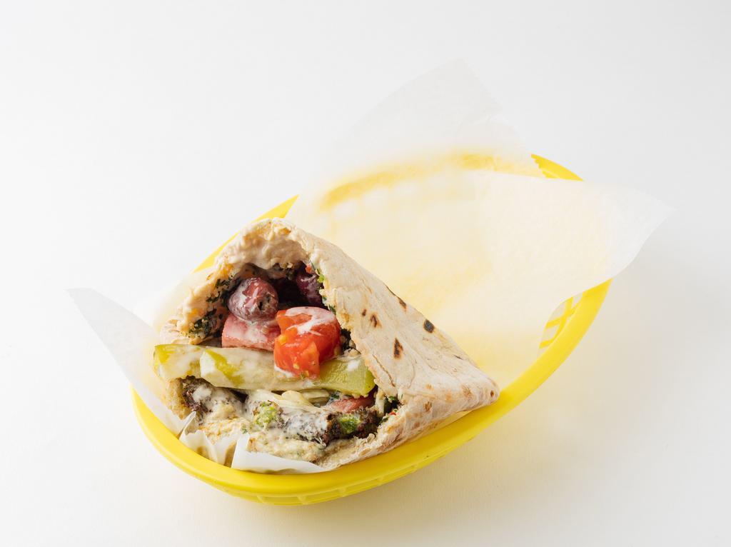 Manhattan Sandwich (Vegetarian) · Falafel, Hummus, Baba Ganouj, and Tabbouleh:  served in a pita pocket with lettuce, tomatoes, onions, pickles, pickled turnips, olives, and tahineh sauce
