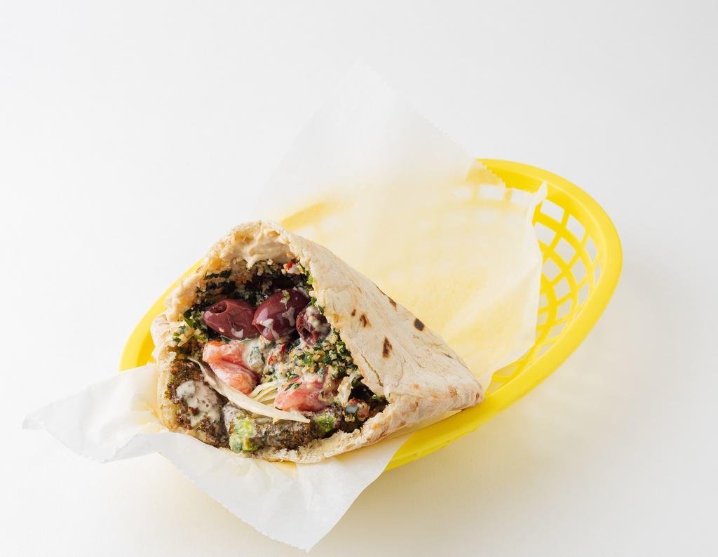 The East Village Sandwich (Vegetarian) · Vegetarian. Falafel, hummus and tabbouleh; served in a pita pocket with lettuce, tomatoes, onions, olives, and tahineh sauce.