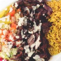 Shawarma Plate · Thinly sliced lamb seasoned with signature spices, cooked slowly on a stand up rotisserie. S...