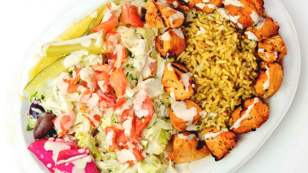 Chicken Kebab Plate · Marinated cubes of chicken breast, skewered and grilled. Served with a pita bread and your choice of salad, rice, or both.