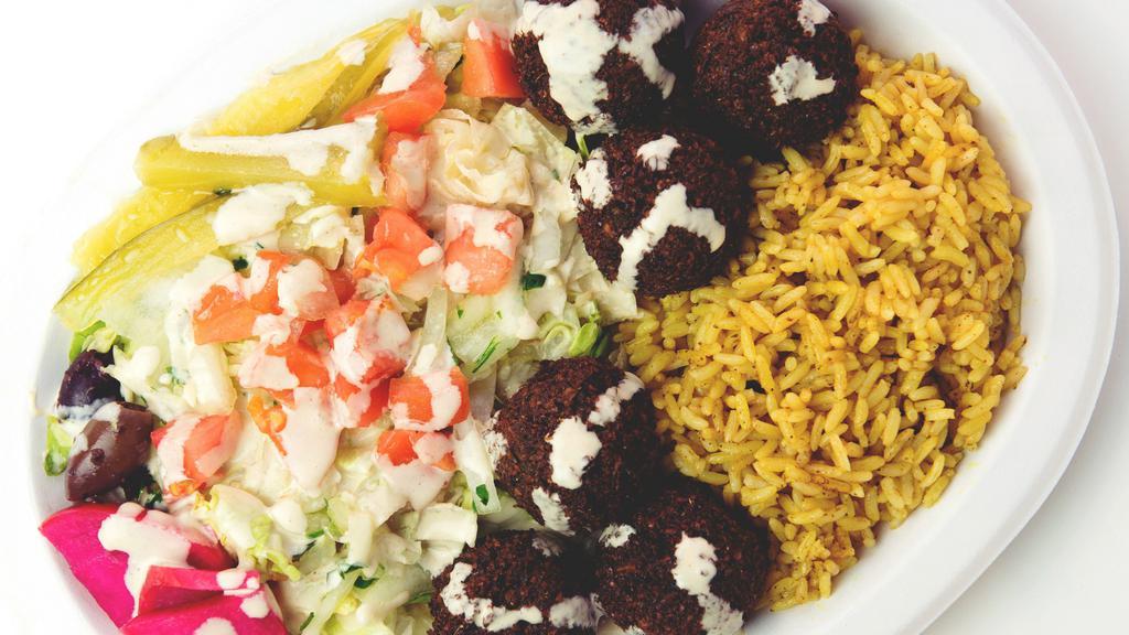 Falafel Plate (Vegetarian) · Finely ground chickpeas, onions, parsley, garlic, and spices, deep-fried; served over a choice of salad or seasoned rice (or both for addt'l charge) and tahineh sauce, with a pita bread on the side