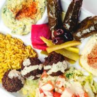 Combo Plate · A la carte plate with a choice of any 3 vegetarian items (add meat for addt'l charge); serve...