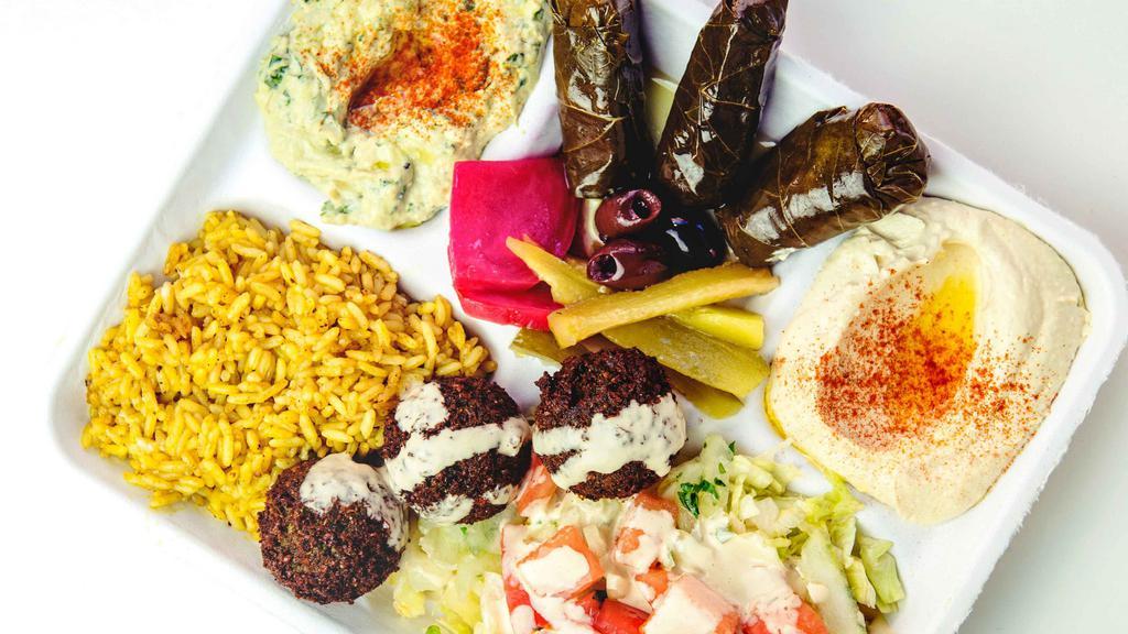 Combo Plate · A la carte plate with a choice of any 3 vegetarian items (add meat for addt'l charge); served over a choice of salad or seasoned rice (or both for addt'l charge) and tahineh sauce, with a pita bread on the side