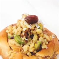 Mabrumeh · Twisted film dough topped with mixed nuts including pistachios, walnuts and almonds.