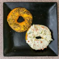 Bagel With Cream Cheese And Bacon · Boiled and baked round bread roll.