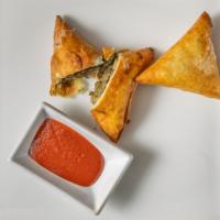 Sambousa · Lentil or meat choices. A pair of ethiopian style triangular phyllo-dough pockets are baked ...