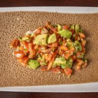 Avocado Salad · Diced avocado mixed with tomatoes, peppers, onion, and tossed in spicy vinaigrette.