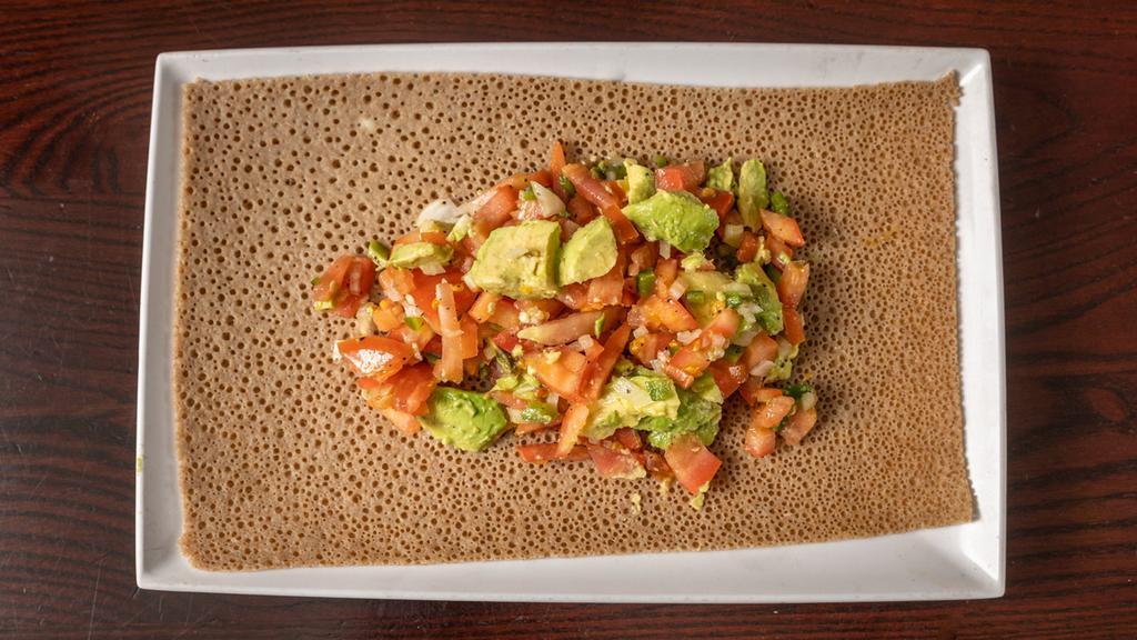 Avocado Salad · Diced avocado mixed with tomatoes, peppers, onion, and tossed in spicy vinaigrette.