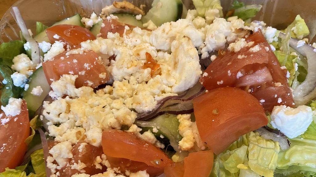 Greek Salad · Romaine, sliced tomato, onions, cucumbers, feta cheese and Greek olives.