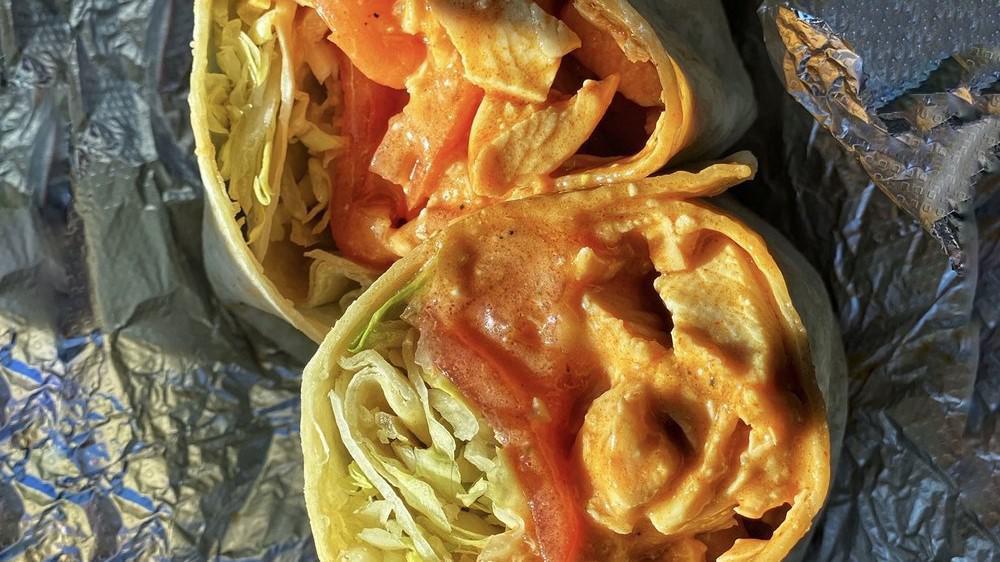 Buffalo Chicken Wrap · Spicy. Our special spicy sauce, smothering chicken with lettuce, tomato and blue cheese.
