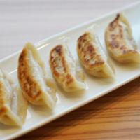 Gyoza · Five fried or steamed dumplings (beef or veg.).