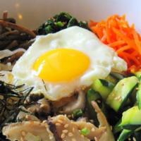Bibimbap(비빔밥) · Rice mixed with choice of meat,  egg, and julienned vegetables with red chili paste on the s...