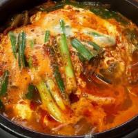 Spicy Beef Stew (육개장) · Shredded beef and vegetables in a spicy broth.