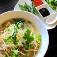 Pho Beef Noodle Soup · Rare eye round over rice noodles in clear beef broth served with bean sprouts, thai basil, c...