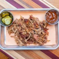 Pulled Pork · 1/2 lb. Dry rubbed and injected pork butt smoked over apple wood. Choose a style: naked, rol...