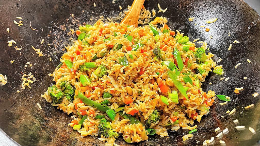 Loaded Vegetable Fried Rice · This classic Asian dish is bursting with crisp mixed vegetables and stir fried with an appetizing blend of seasonings and your choice of jasmine or brown rice.  Extra protein option is available.