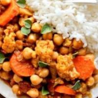 Vegetable Curry · Pan-seared cauliflower, chick peas and crisp vegetables are slowly cooked in fresh Caribbean...