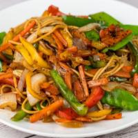 Vegetable Lo Mien · Soft lo mien noodles are stir fried  in a unique Caribbean sauce and loaded with fresh, cris...