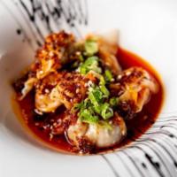 Spicy Chicken Wonton · Spicy ground chicken wontons filled with mushrooms served with spicy sesame chili oil