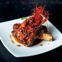 Sticky Ribs · Twice cooked Pork Rib, Cilantro, served with Hoisin Sweet Chili Sauce.