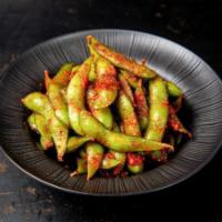 Spicy Edamame · Edamame sauteed in butter, and tobanjan sauce and a spice blend.