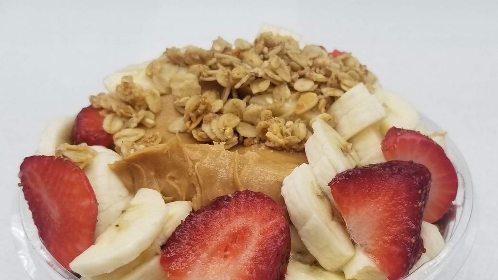 Peanut Butter Acai Bowl · Organic Acai blended with banana, peanut butter and almond milk. Topped with granola, strawberry, and banana.
