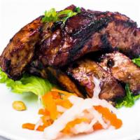 Suon Nuong · Grilled back ribs marinated with five spices.