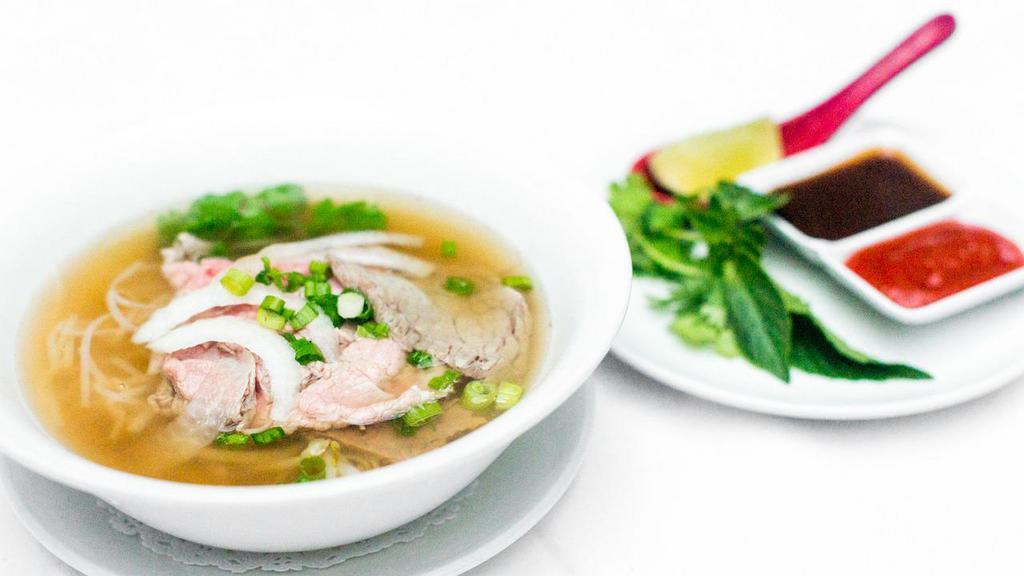 Pho Bo · Beef soup with rice noodles, aromatic herbs.