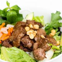 Bun Bo Xao · Wok-seared lemongrass beef, vermicelli salad, peanuts.