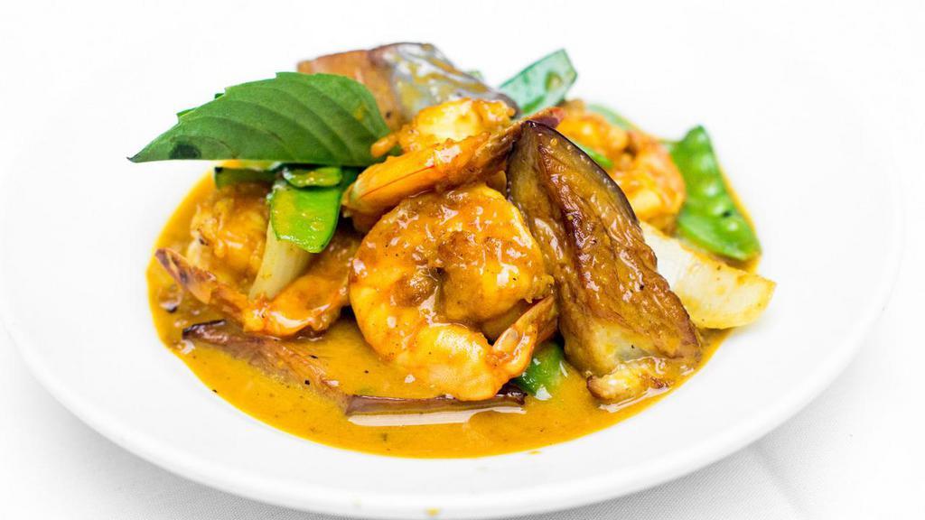 Cari Tom · Sautéed jumbo shrimp with vegetables, light coconut curry sauce.