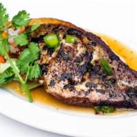 Ca Chien · Crispy red snapper in chili lime sauce.