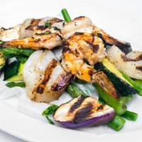 Tom So Nuong · Grilled prawn, scallop and vegetable, lime basil sauce.