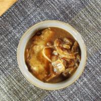 French Onion Soup · Rich broth of onions and buttery beef stock with a thick slice of toast and melty Gryere che...