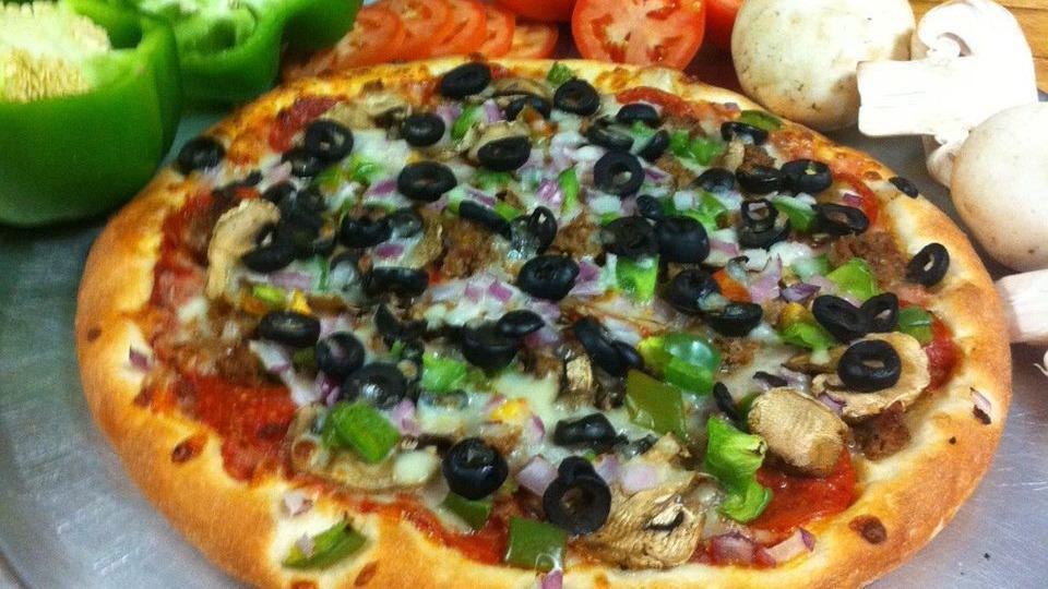 Vegetarian Pizza · Mushrooms, peppers, broccoli, spinach and onions.