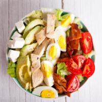 Cobb Salad · Satisfying salad full of mixed greens, corn, tasteful tomatoes, hard boiled egg, oven roaste...