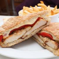 Chicken And Spinach Panini · Grilled chicken, sautéed spinach, and melted mozzarella. Served with homemade coleslaw and p...