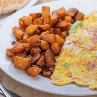 Western Omelette · Ham, peppers, and onions. Served with potatoes and toast.