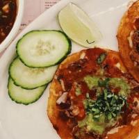 Tacos Al Pastor · Adobo marinated Berkshire pork, onion, cilantro, pineapple