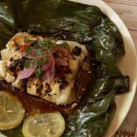 Mone De Pescado · Steamed Chatham cod, in banana leaf, sweet plantains, tomato, Fresno chiles, caramelized oni...