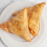 2 Piece Vegetable Samosa · Baked pastry with potato and pea filling.
