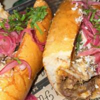  Philly Cheesesteak · A toasted hero bread with mozzarella cheese and chopped birria and pickled red onions with s...