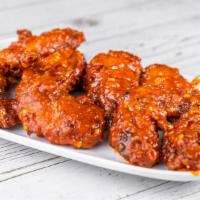 Indian Buffalo Wings · A dozen wings mixed in herbs and spices combined with sweet chills and a touch of curry flav...