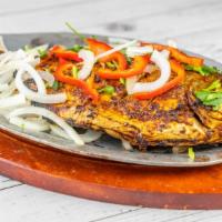 Tandoori Fish · Fish prompt marinated in a special recipe, cook in the tandoor.