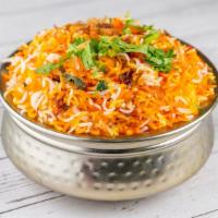 Chicken Biryani · Basmati Rice Cooked with Chicken mixed with Onion, Cashew Nuts and Raisins flavored with Saf...